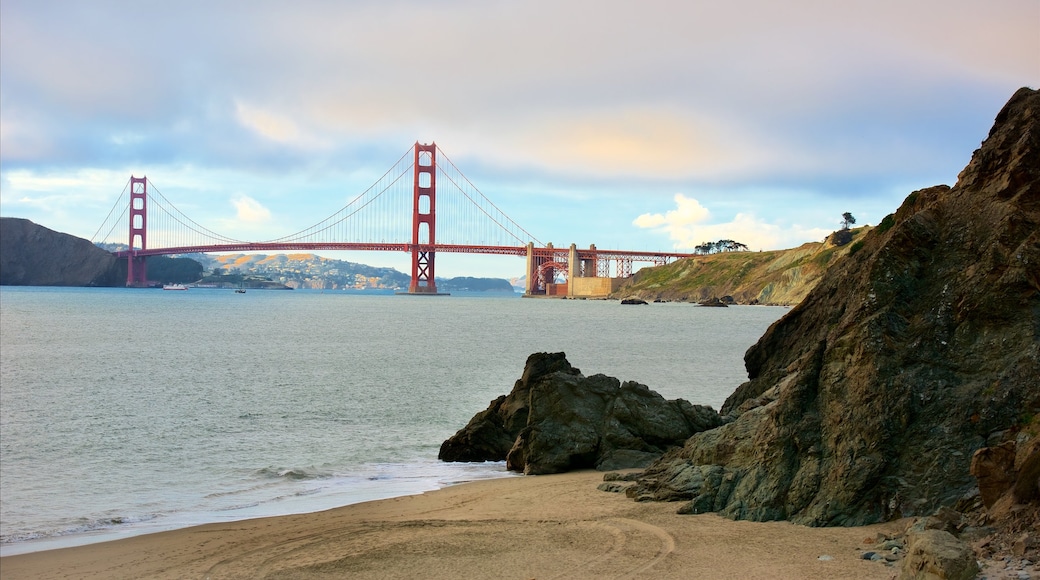 China Beach which includes general coastal views, a beach and a suspension bridge or treetop walkway