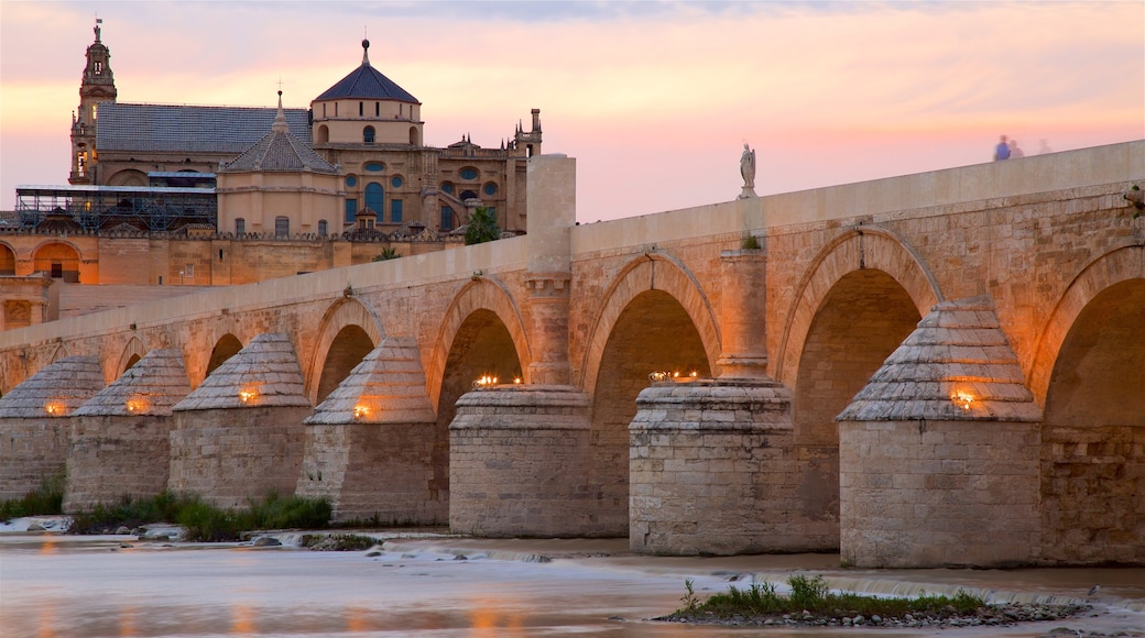 Roman Bridge which includes a bridge, a river or creek and heritage elements