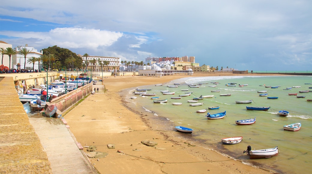 La Caleta Beach showing boating, a coastal town and a sandy beach