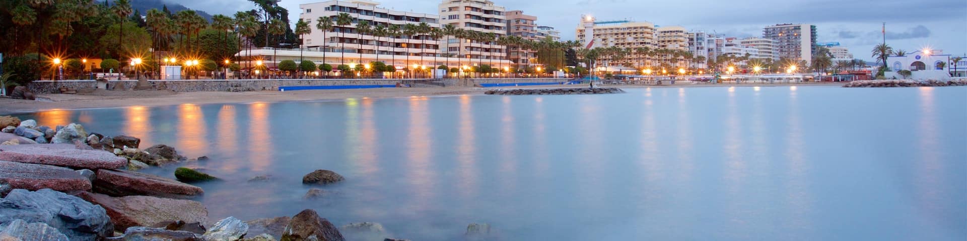 Marbella featuring general coastal views, a coastal town and rugged coastline
