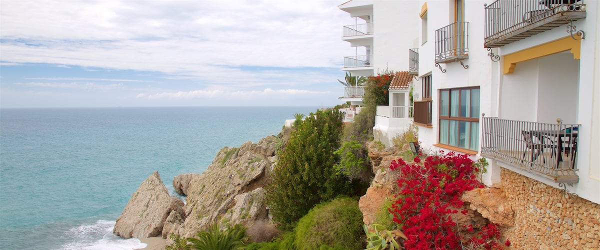 Nerja which includes a coastal town, general coastal views and a sandy beach