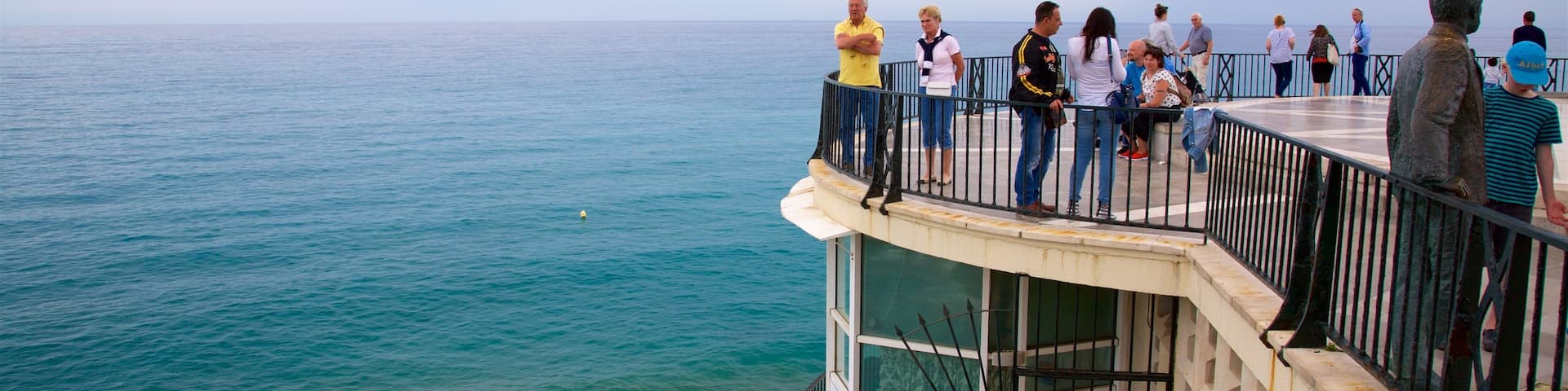 Balcon de Europa which includes general coastal views and views as well as a large group of people