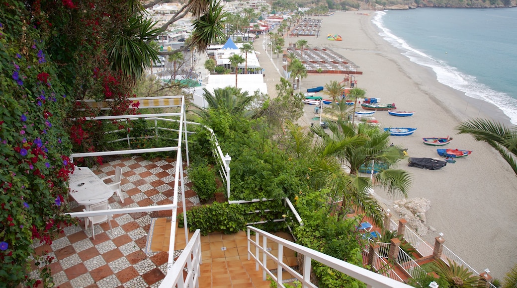 Burriana Beach showing a garden and a sandy beach