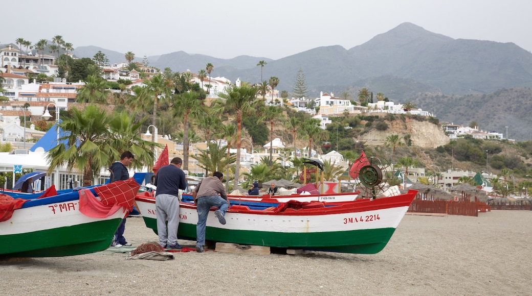 Burriana Beach which includes a sandy beach, a coastal town and boating