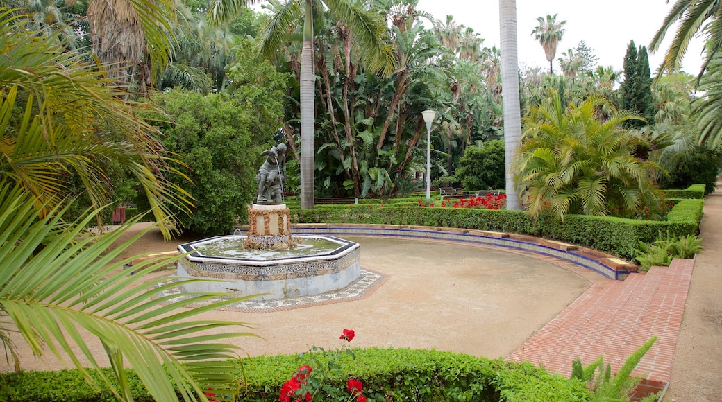 Alameda del Tajo toont een standbeeld of beeldhouwwerk, een park en een fontein