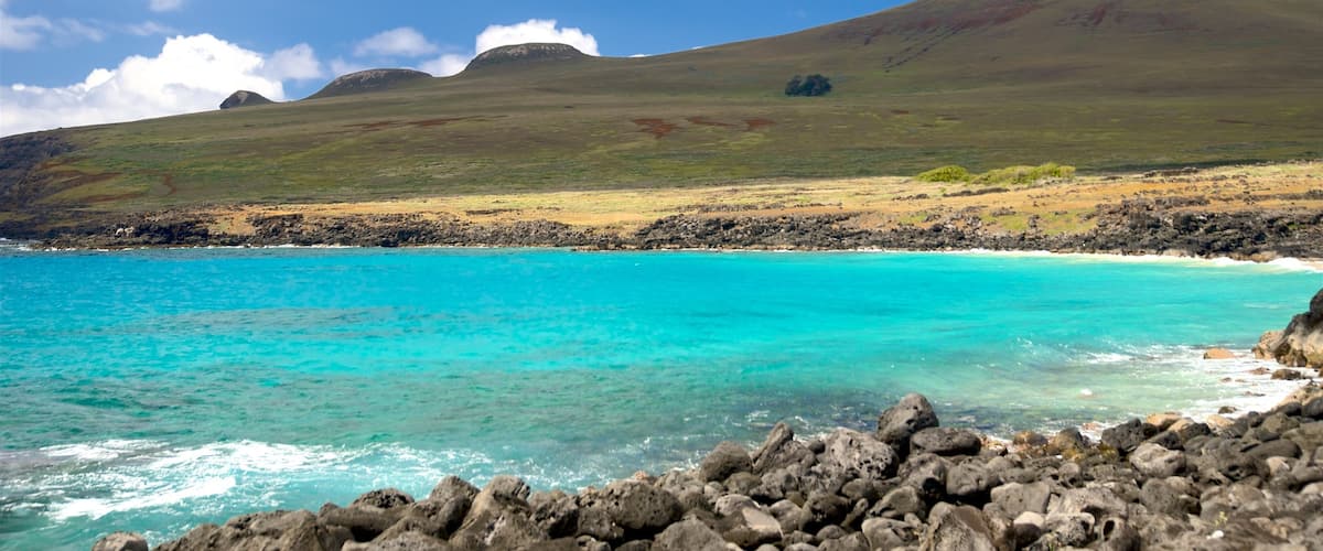 Easter Island featuring general coastal views, mountains and rocky coastline
