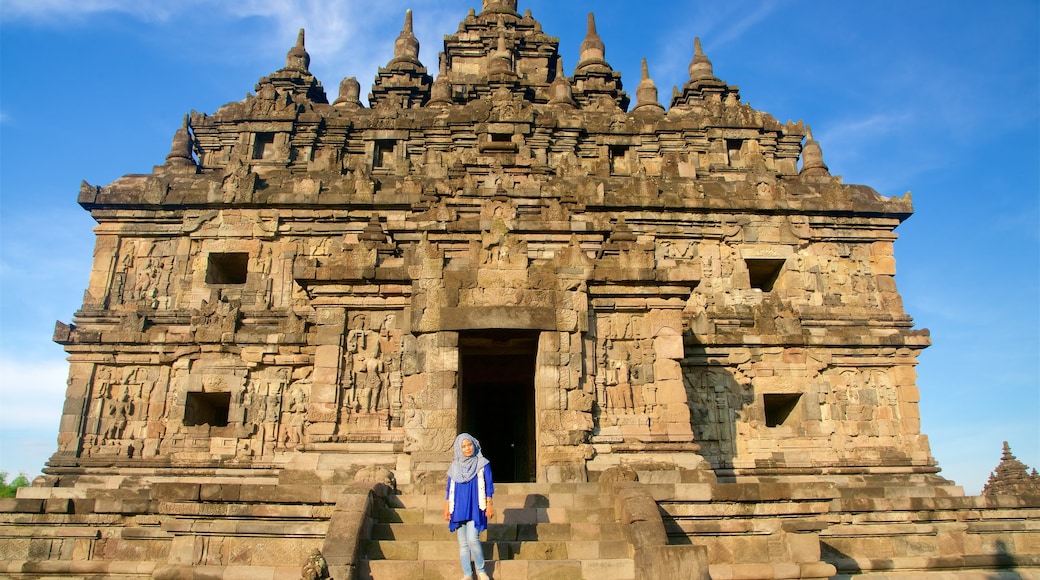 Prambanan showing heritage architecture as well as an individual femail