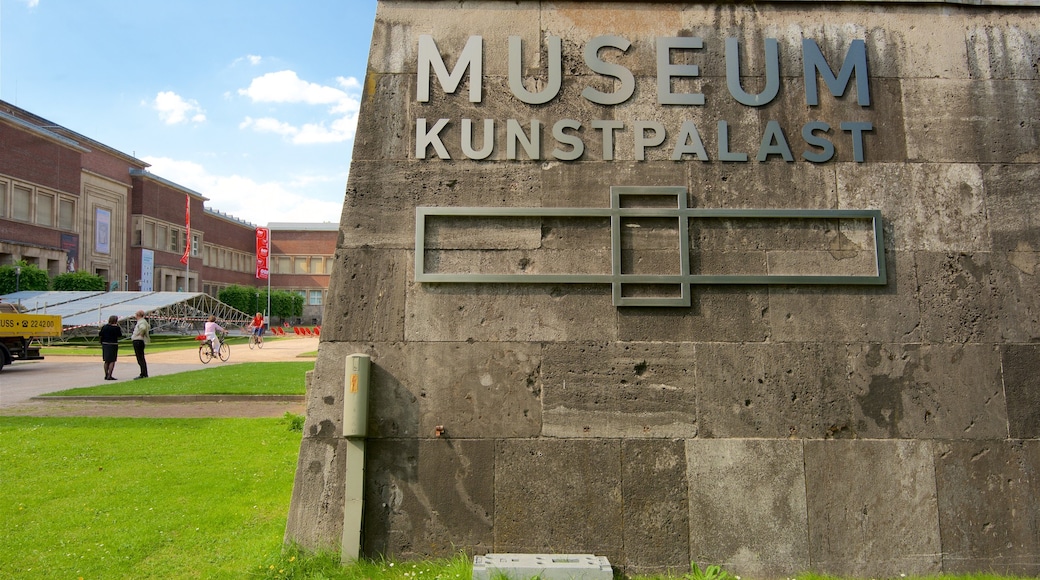 Museum Kunstpalast showing signage and a garden