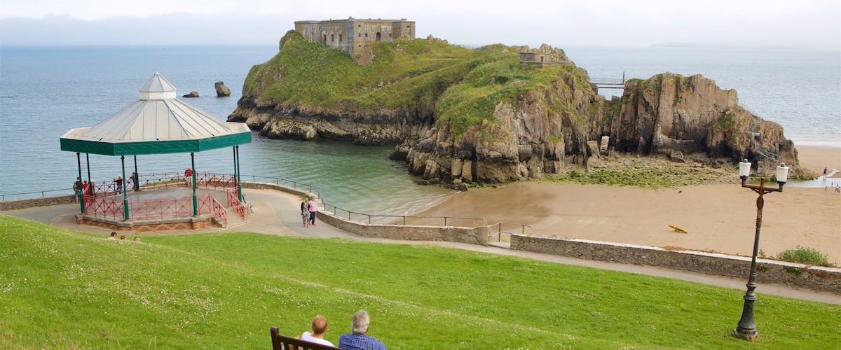 Tenby showing a sandy beach, chateau or palace and views
