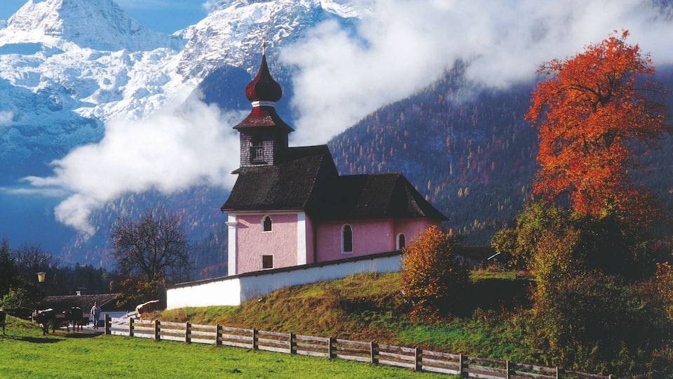 Salzburg featuring a church or cathedral and mist or fog