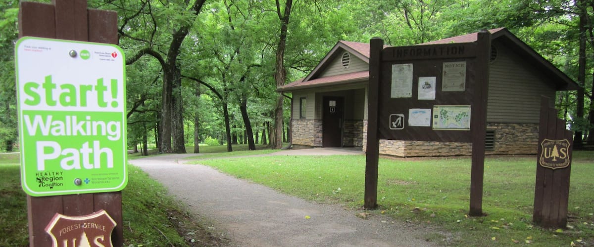 Lincoln Monument which includes forest scenes and signage