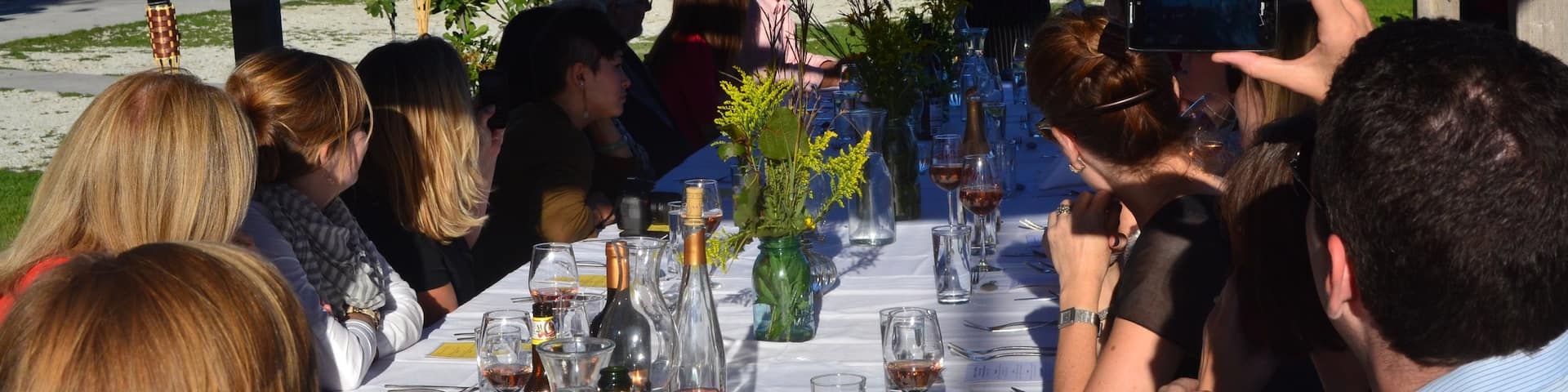 Champaign showing outdoor eating as well as a small group of people