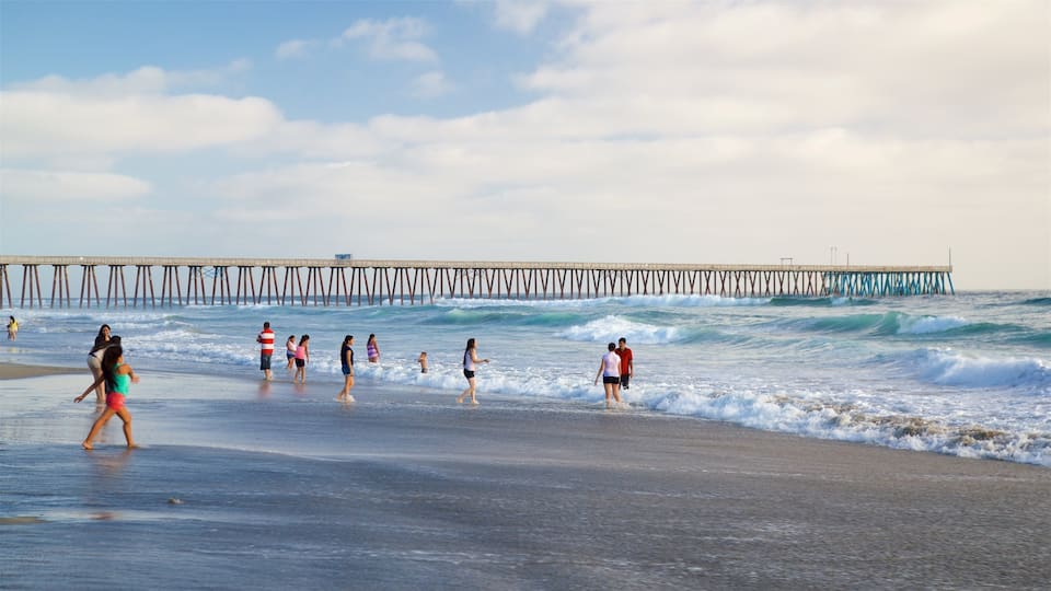 Rosarito featuring a sandy beach and waves