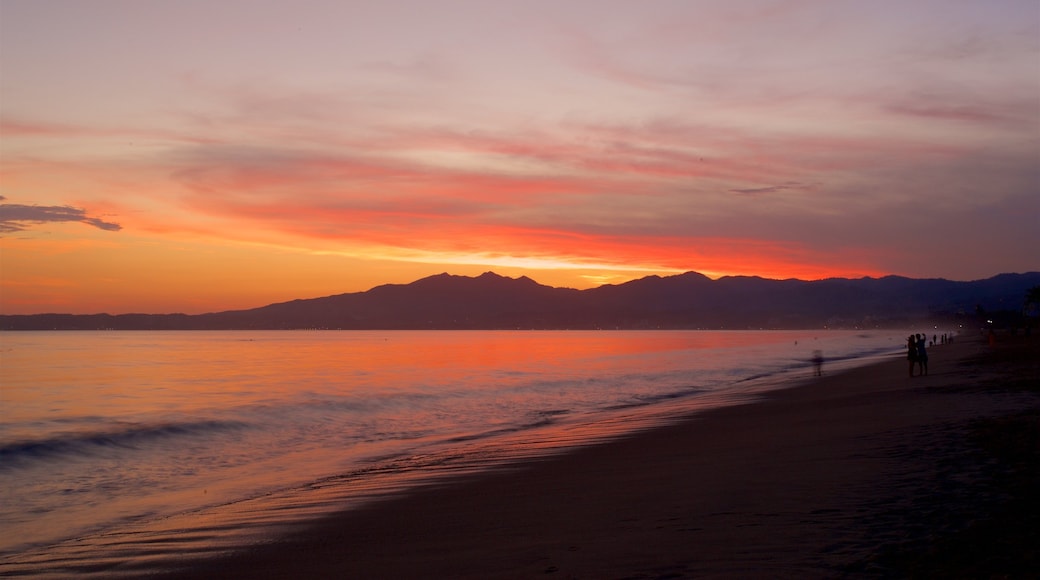 Nuevo Vallarta Beach which includes a beach, a sunset and general coastal views