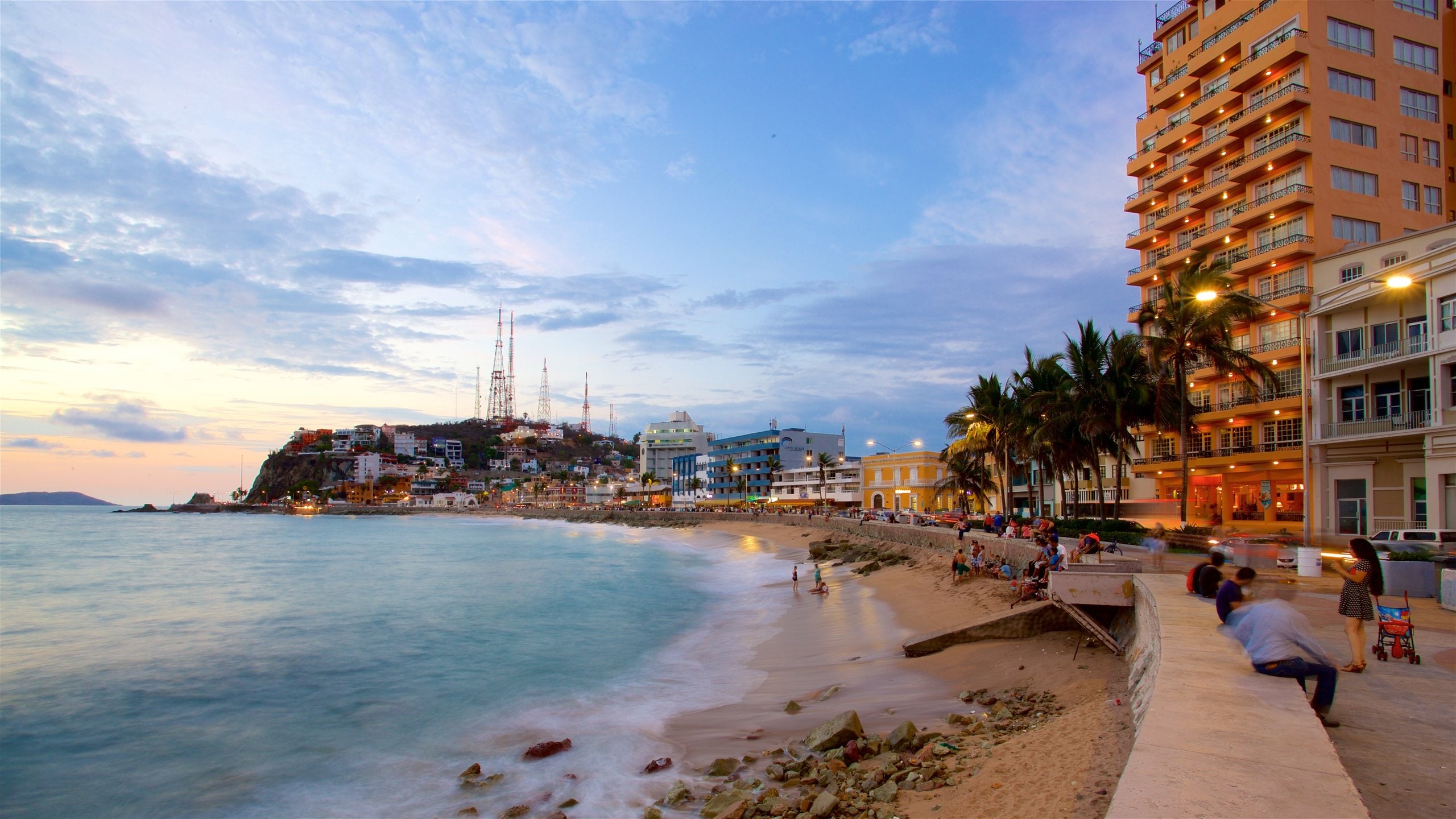 Olas Altas Beach featuring a sunset, a sandy beach and general coastal views