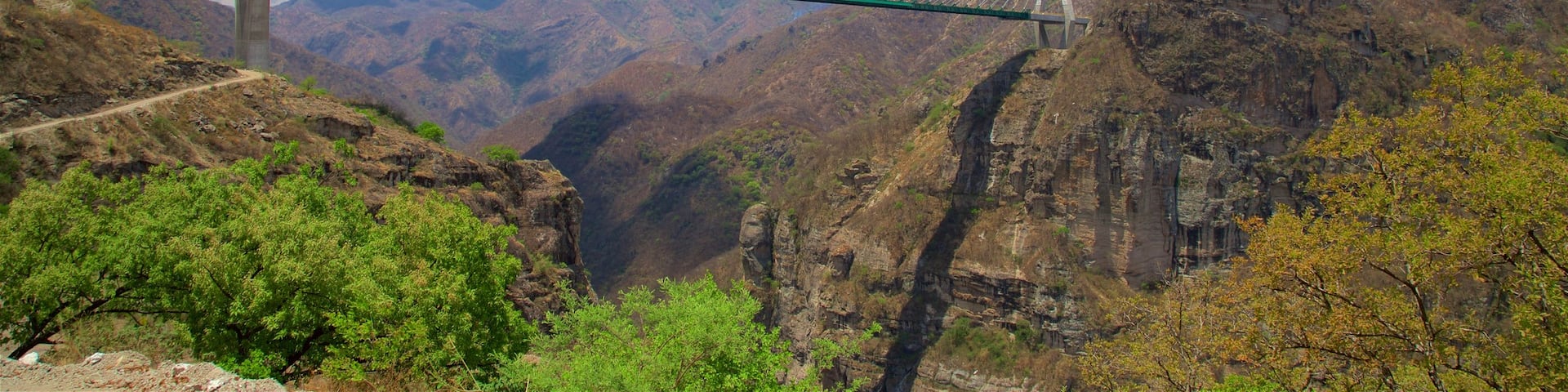Mazatlan showing a gorge or canyon and a bridge