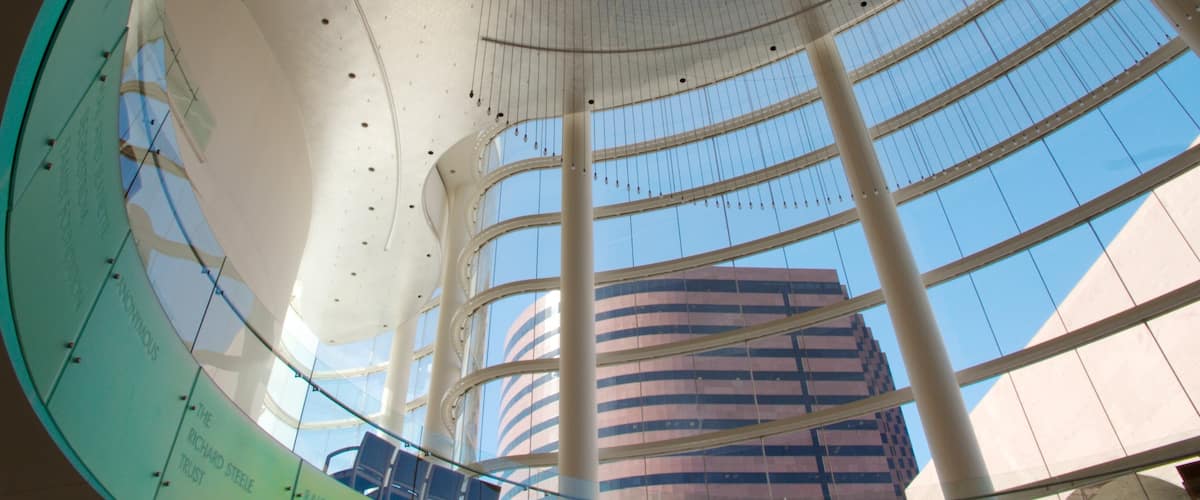 Costa Mesa showing a skyscraper, art and interior views