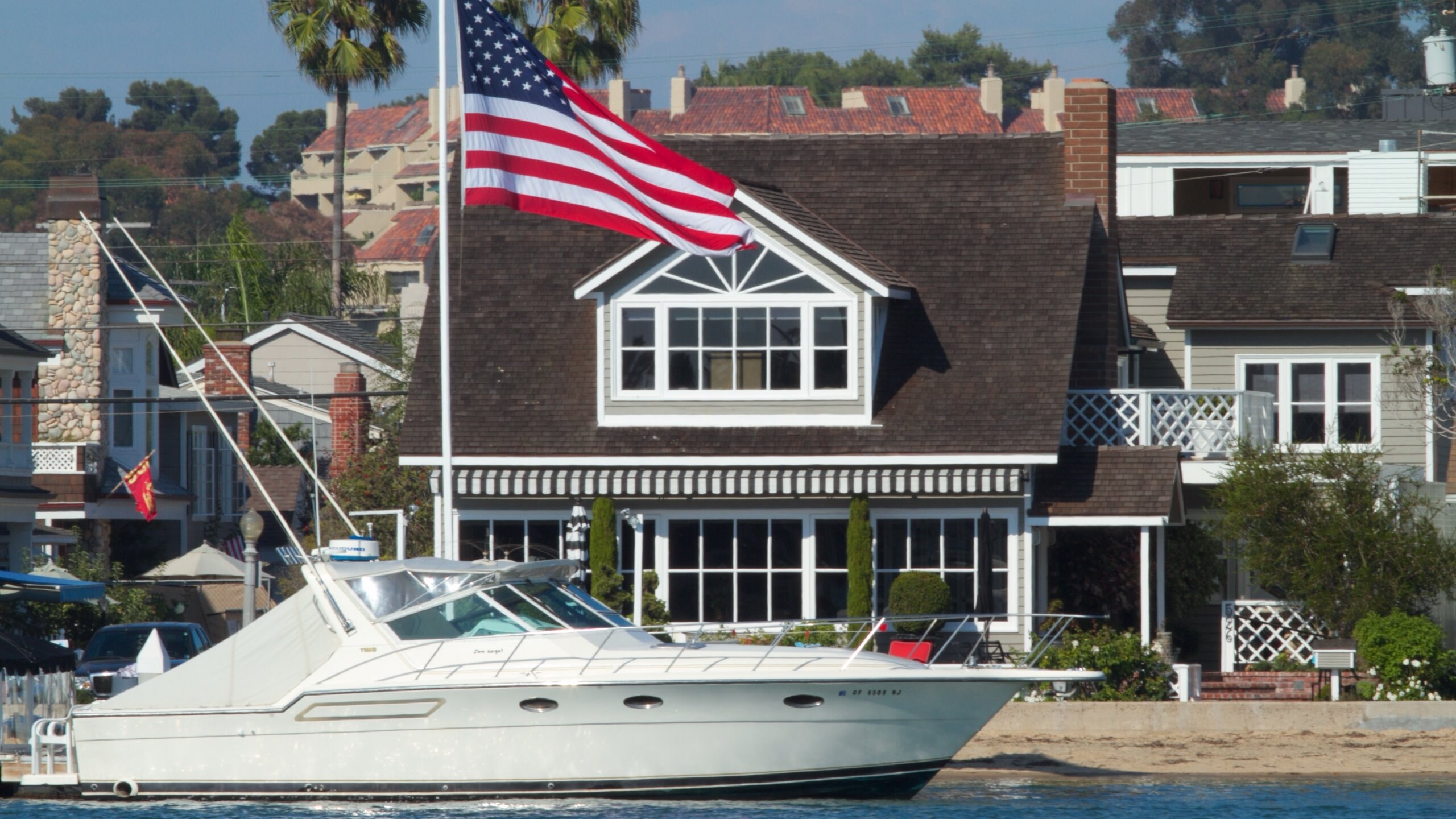 Orange County showing boating, a house and a bay or harbor