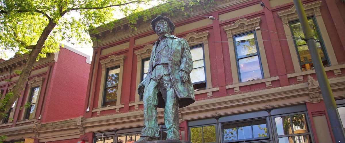Gastown showing outdoor art, a statue or sculpture and a city