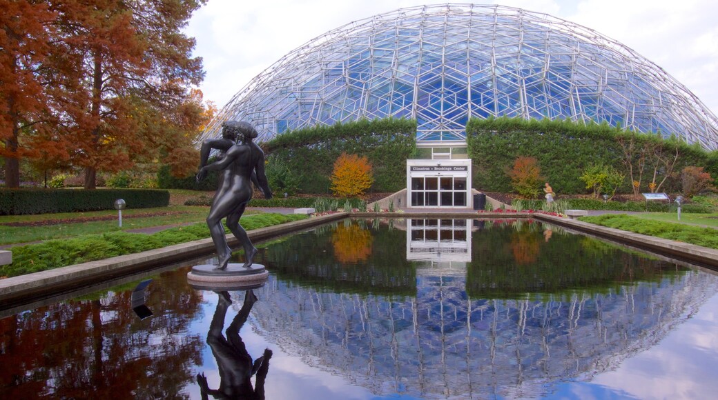 St. Louis featuring a statue or sculpture, a garden and a pond