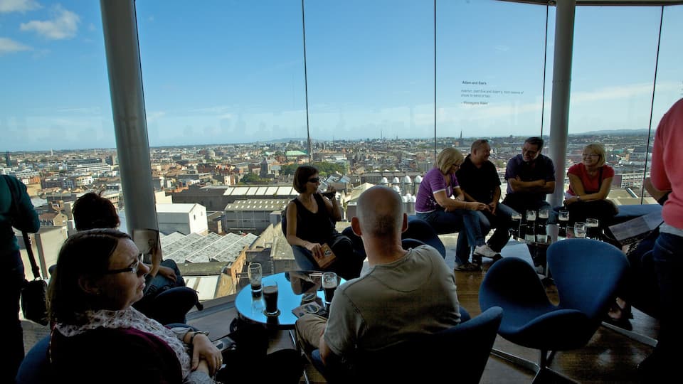 Guinness Storehouse showing interior views, a city and drinks or beverages