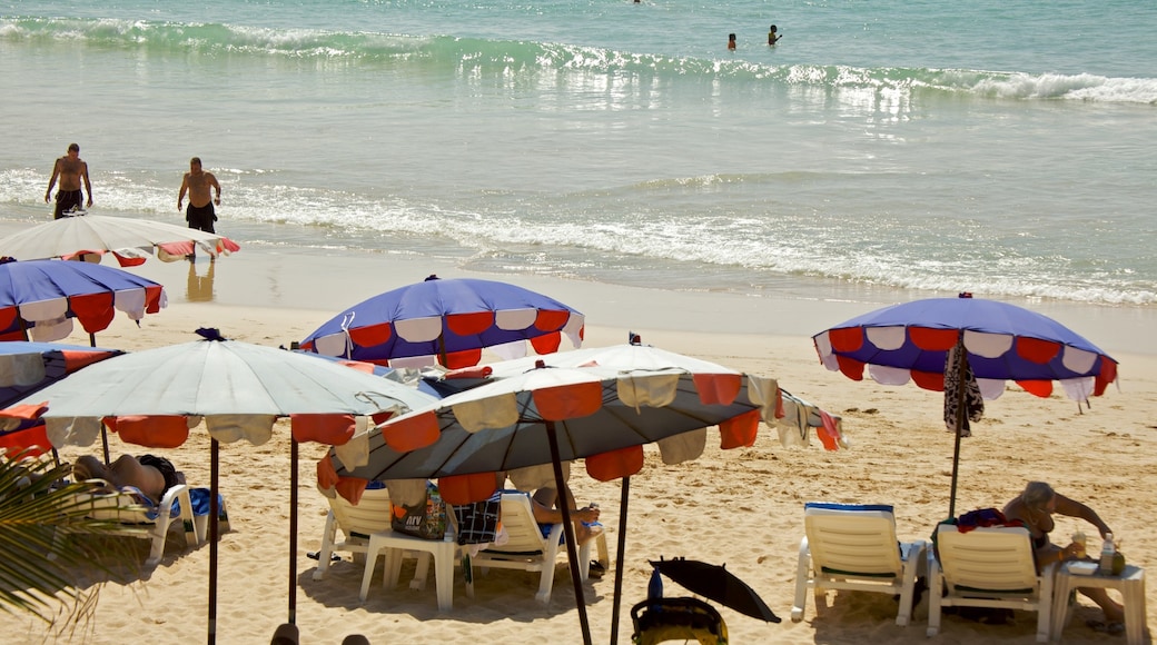 Nai Harn Beach showing landscape views, swimming and a sandy beach