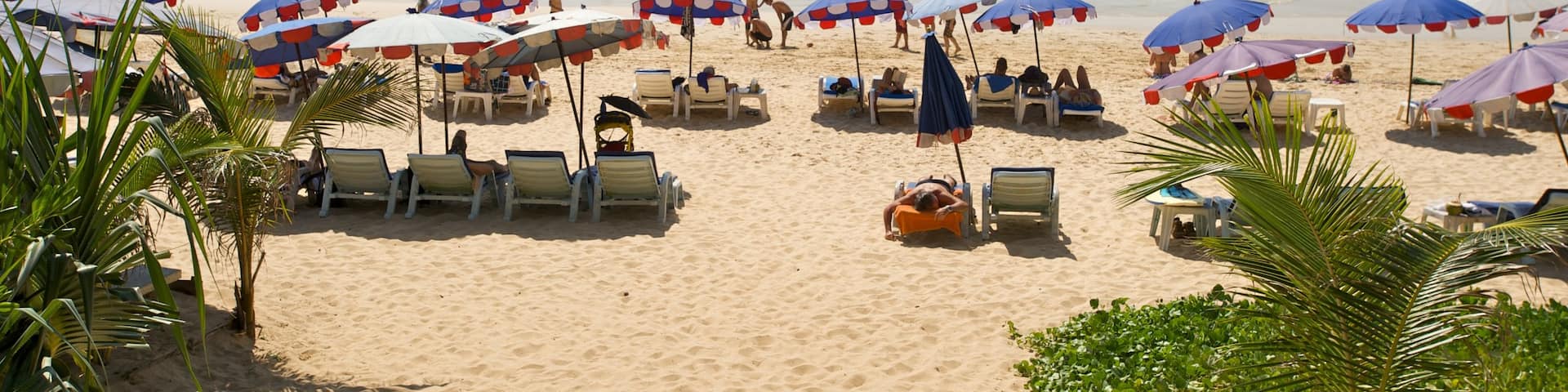Nai Harn Beach featuring a sandy beach, landscape views and swimming