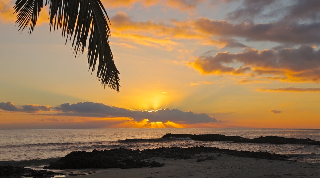 Yasawa Islands which includes a sunset, landscape views and a beach