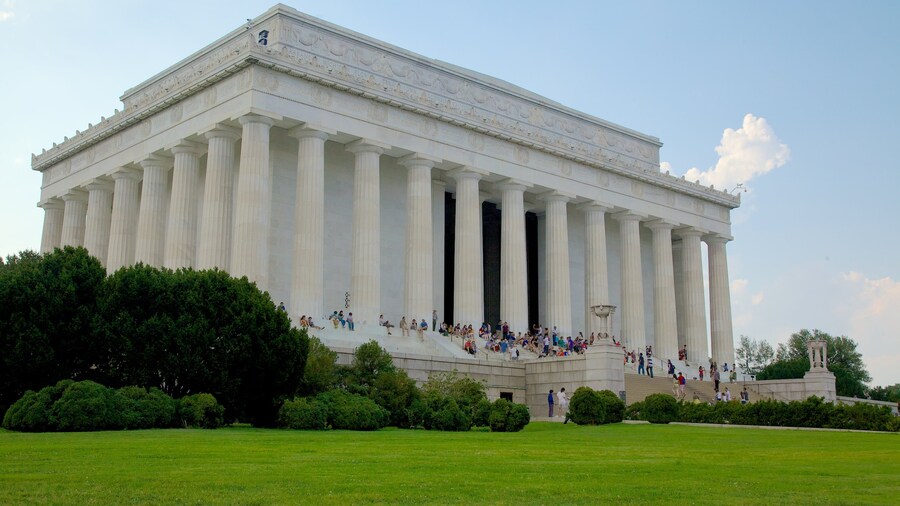 Lincoln Memorial with visitors on its steps, surrounded by greenery in Washington, D.C.