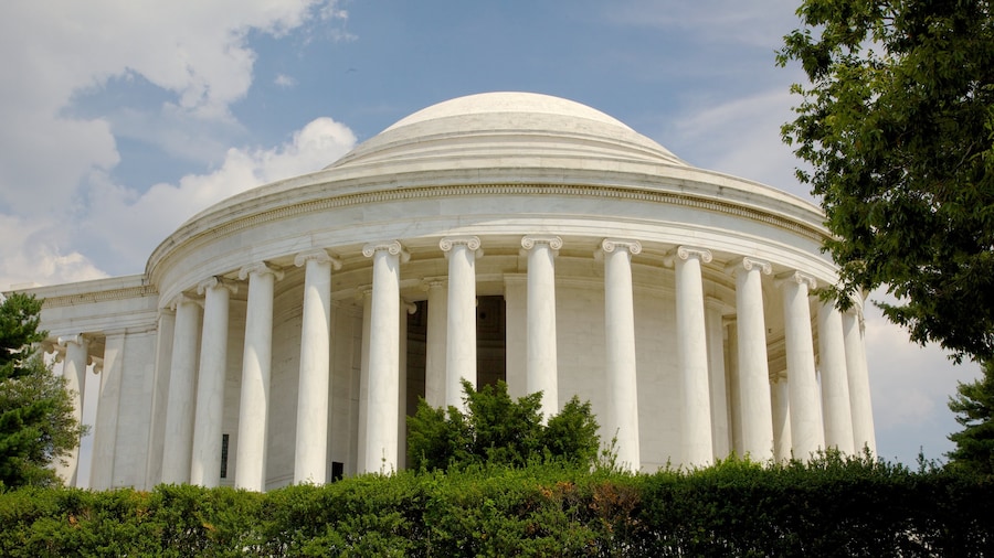 Jefferson Memorial surrounded by greenery under a clear sky in Washington, D.C.