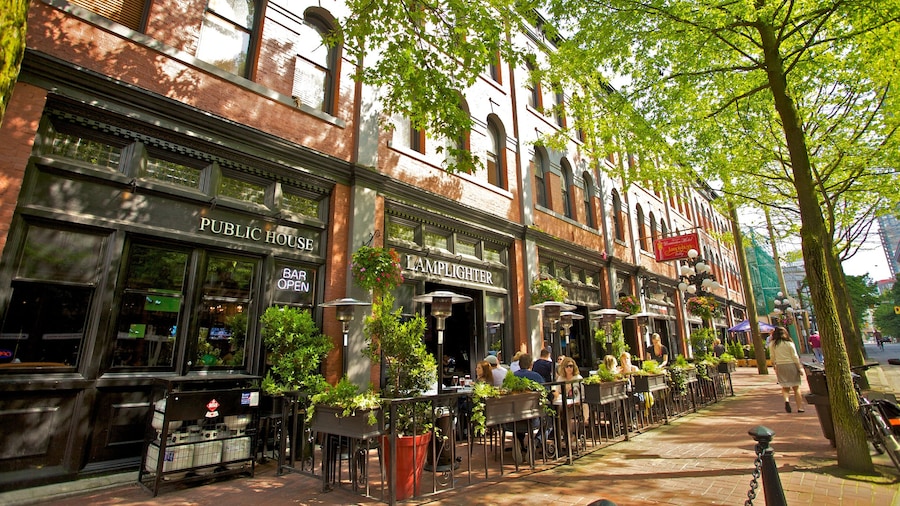 Outdoor dining and Victorian architecture along cobblestone streets in Gastown, Vancouver, British Columbia.