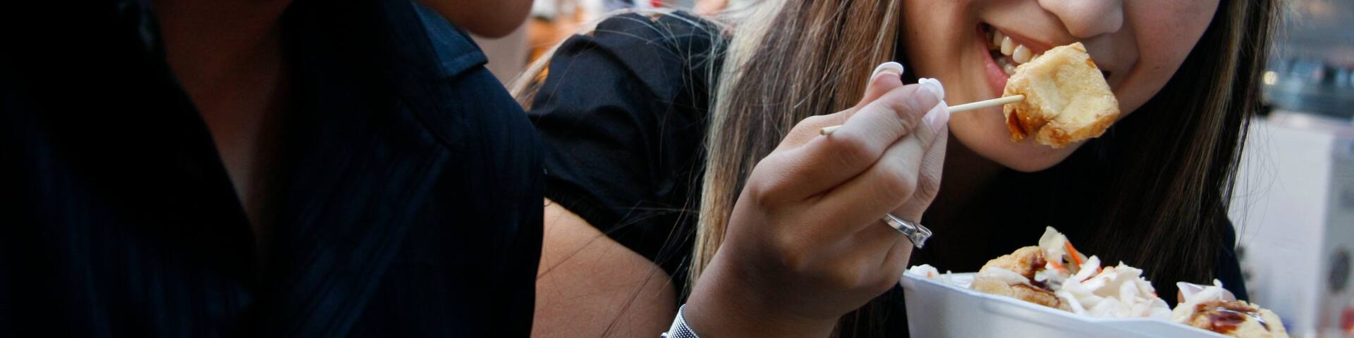 Chinatown featuring dining out and food as well as a couple