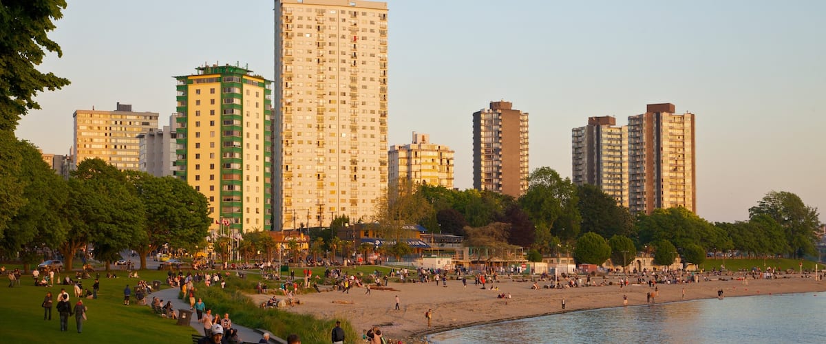 English Bay Inukshuk featuring a bay or harbor, central business district and a skyscraper