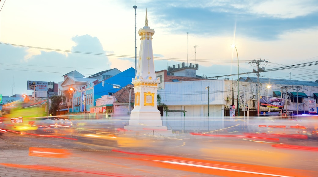 Tugu Monument which includes a sunset