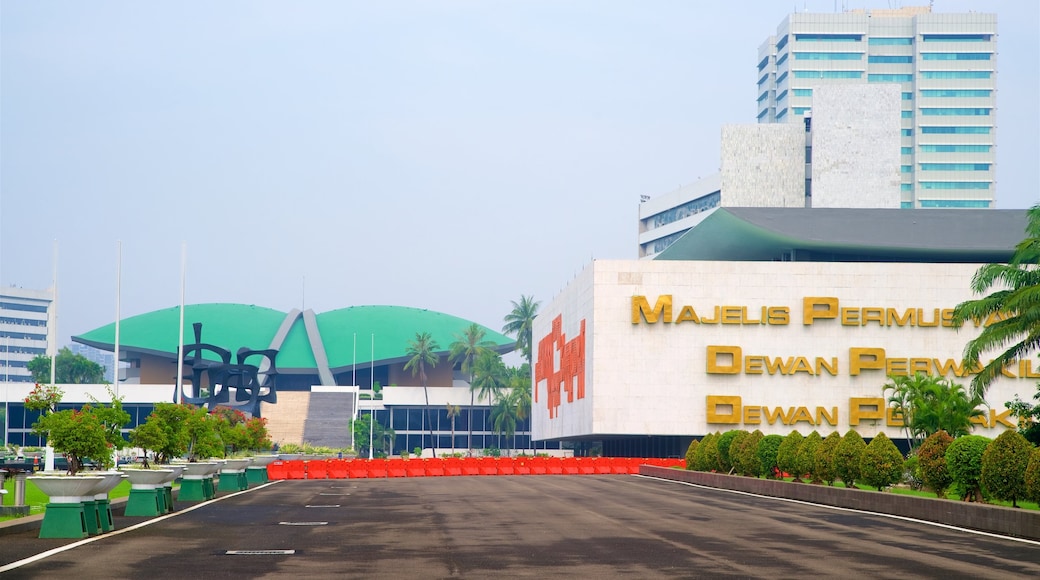 Jakarta featuring a square or plaza, a garden and signage