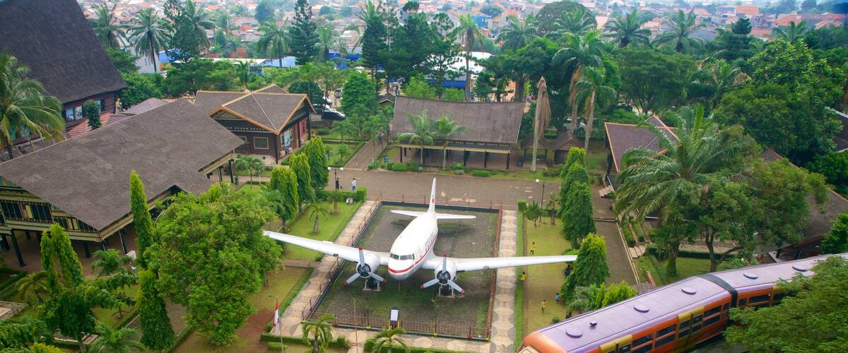 Taman Mini Indonesia Indah which includes aircraft, landscape views and railway items