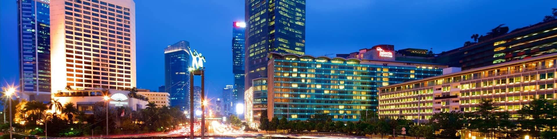 Bundaran Hi which includes a fountain, a city and night scenes