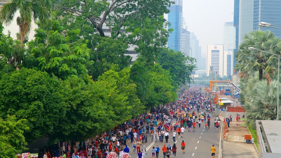 Jakarta showing a city as well as a large group of people