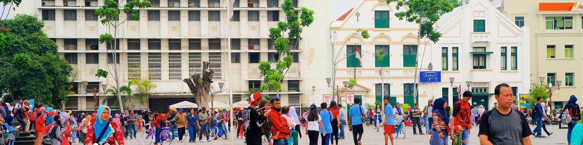 Old Jakarta which includes a square or plaza as well as a large group of people