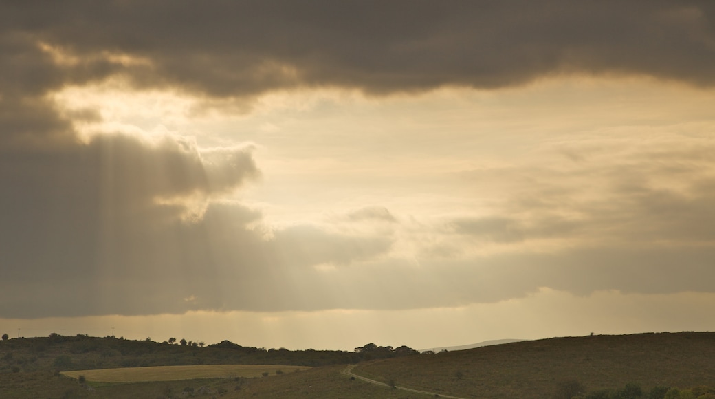 Marble Arch Caves featuring tranquil scenes, a sunset and landscape views