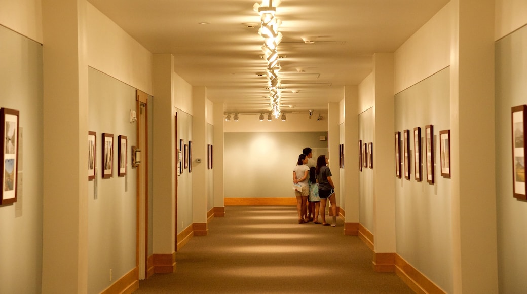 National Wildlife Art Museum featuring interior views and art as well as a family