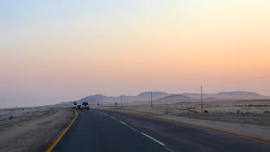 Swakopmund welches beinhaltet Wüstenblick, Sonnenuntergang und ruhige Szenerie