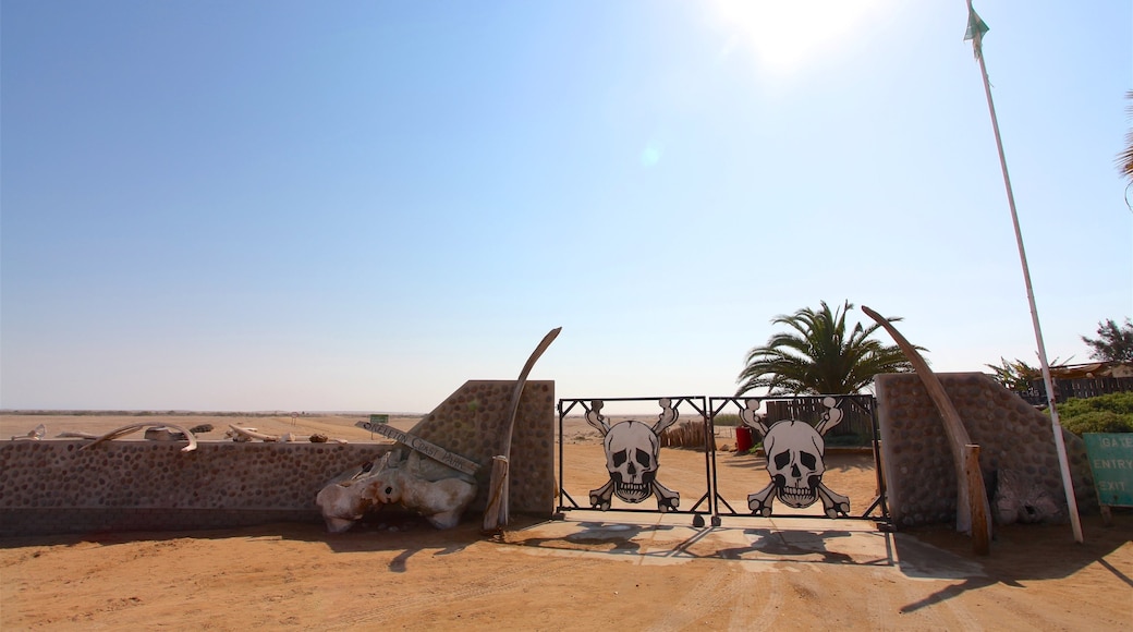 Skeleton Coast National Park showing signage and desert views