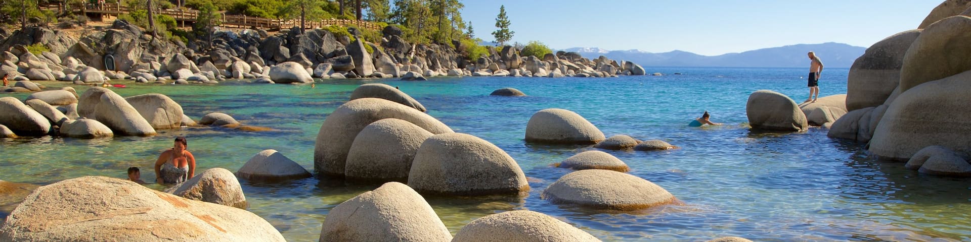 Sand Harbor which includes swimming, rugged coastline and general coastal views