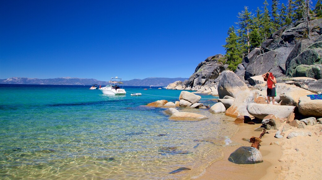 D. L. Bliss State Park showing a lake or waterhole, rugged coastline and a sandy beach