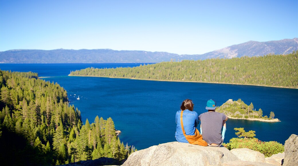 Vikingsholm Castle which includes tranquil scenes, a lake or waterhole and views