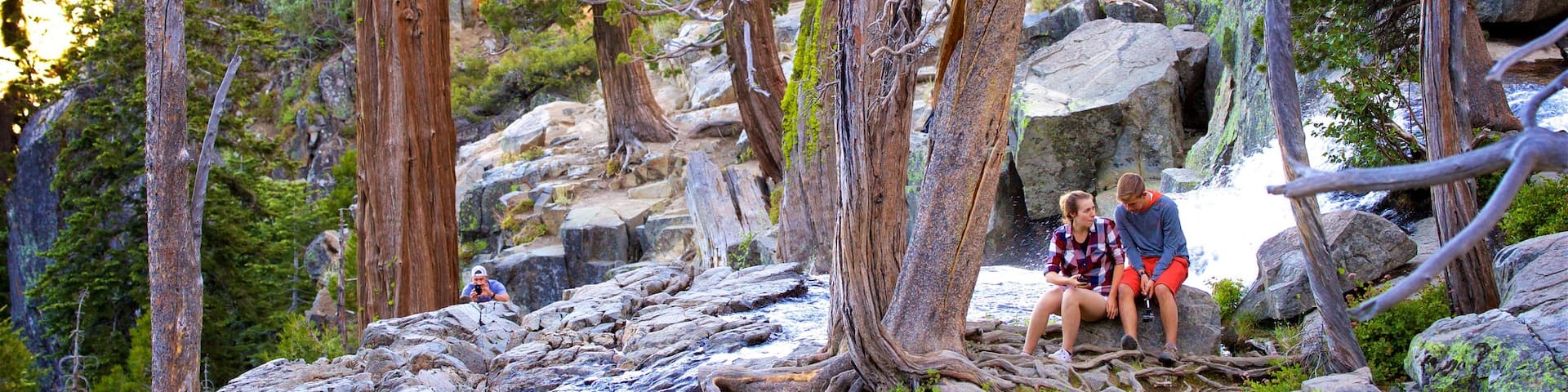 South Lake Tahoe showing a river or creek and forests as well as a couple