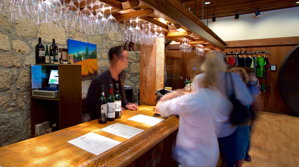 Chateau Montelena Winery showing a bar and interior views as well as a small group of people