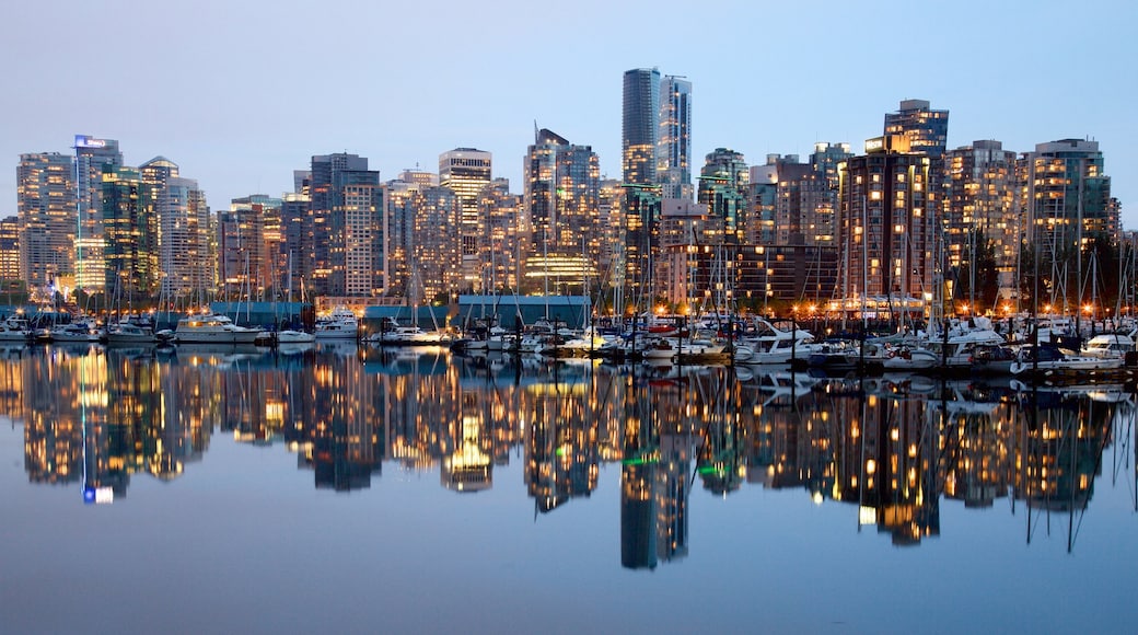 Stanley Park which includes a bay or harbour, a skyscraper and a city