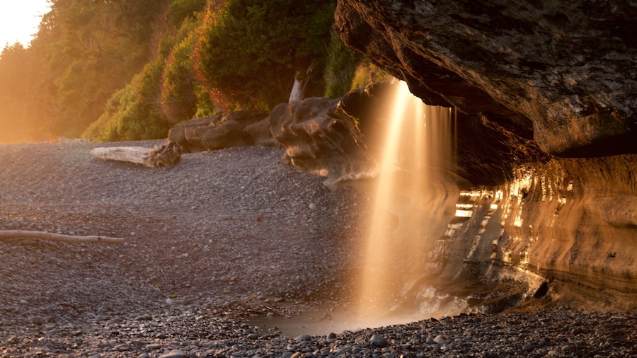 Sandcut Beach which includes a sunset and a pebble beach